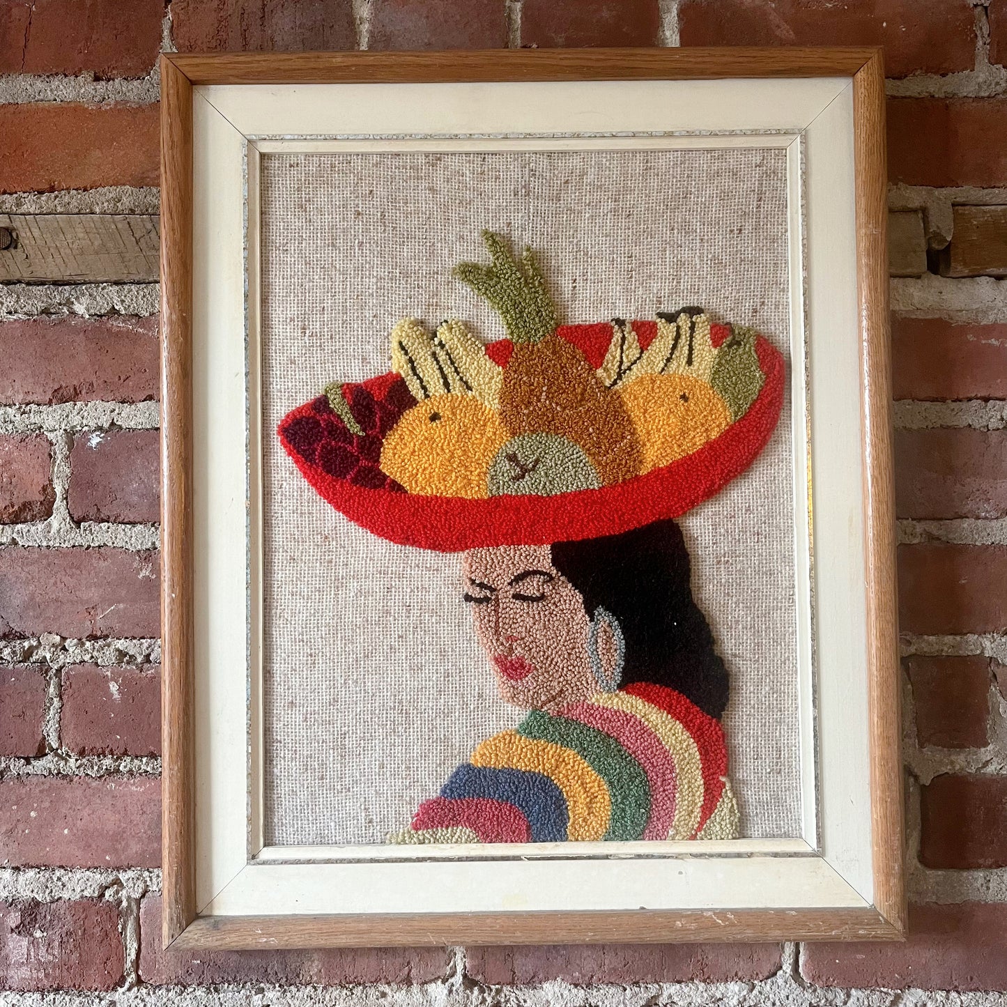 Woman with fruit bowl punch needle art