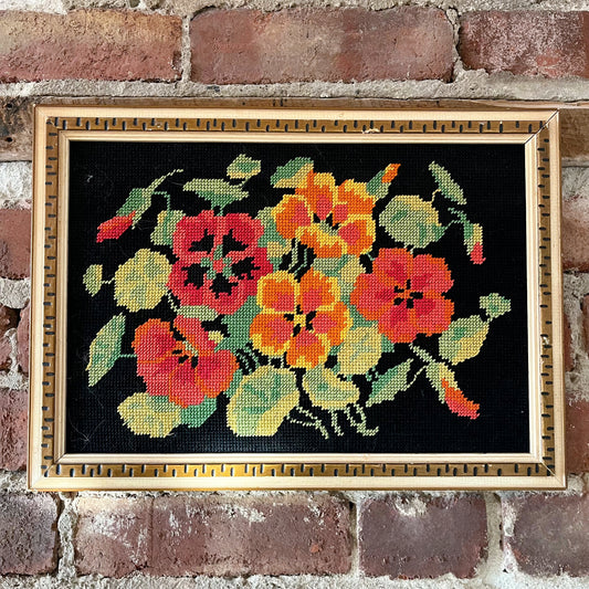 Bright floral needlepoint on black background