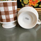 Brown and white gingham checker mugs