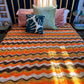 Crocheted orange, yellow and brown chevron retro throw blanket