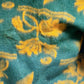 Green and yellow wool floral blanket