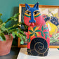 Chat folk art peint à la style de Laurel Burch