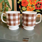 Brown and white gingham checker mugs