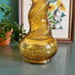 Vintage Italian Empoli amber genie bottle with snake pattern