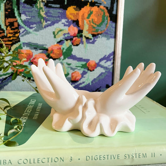 White ceramic hands card holder