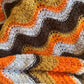 Crocheted orange, yellow and brown chevron retro throw blanket