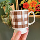 Brown and white gingham checker mugs