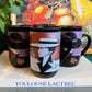 80s glam black mugs with metallic face designs