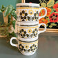 1970s Bilton mugs with retro yellow and brown flowers