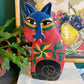 Chat folk art peint à la style de Laurel Burch