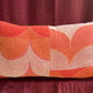 Vintage towel throw pillow: orange & purple waves