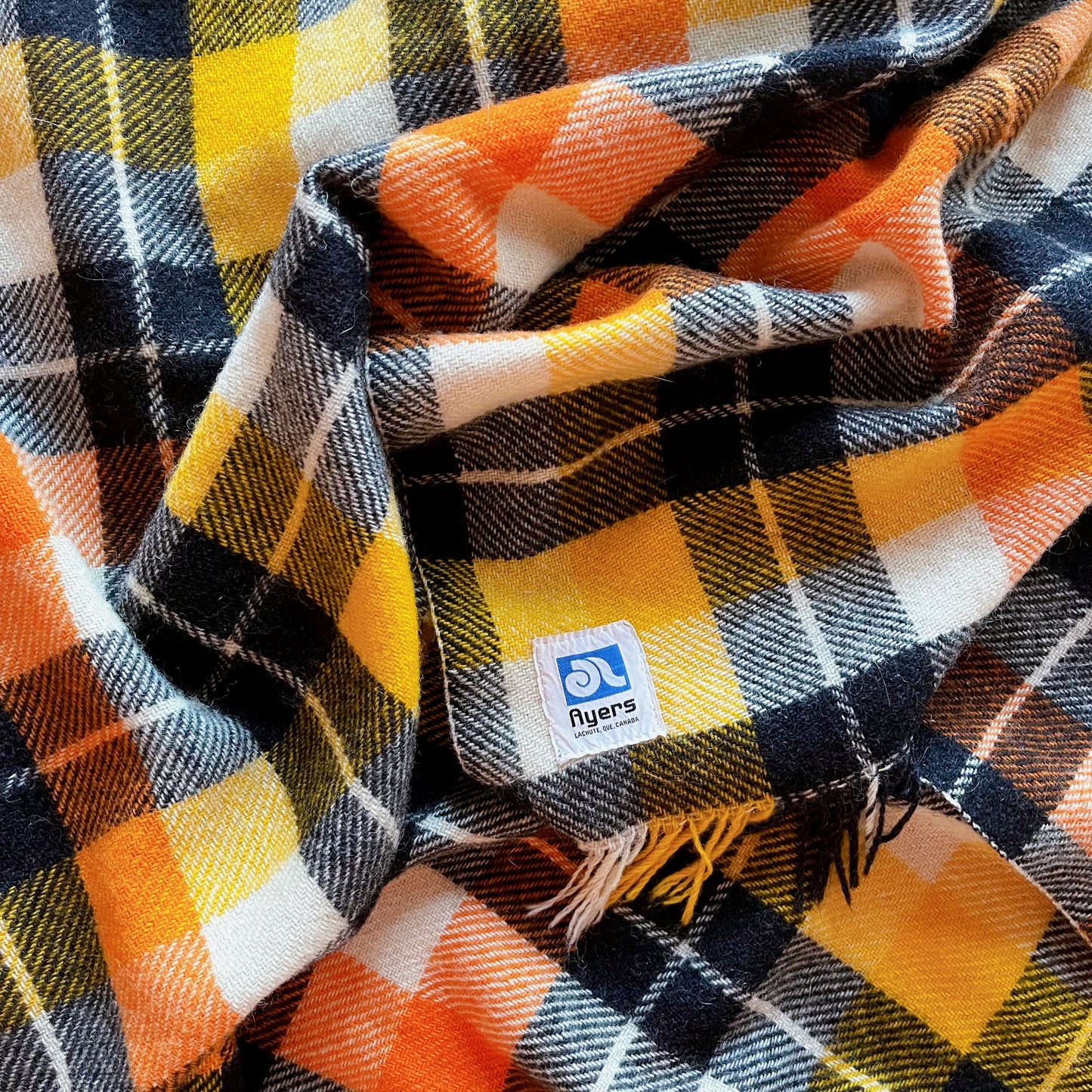 Ayers wool blanket in black, orange, yellow and white plaid