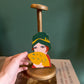 Antique figural wooden hat stand with a flapper